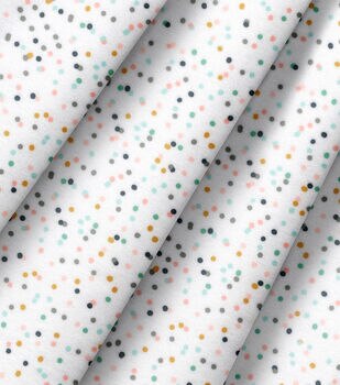 white fabric with rainbow polka dots by Robert Kaufman Fabric by
