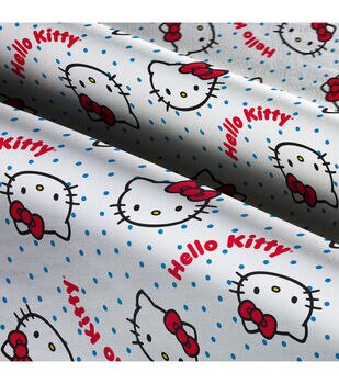 Hello Kitty fabric -- Hello Kitty, bows, and pink polka dots on red -- 100%  cotton quilting fabric