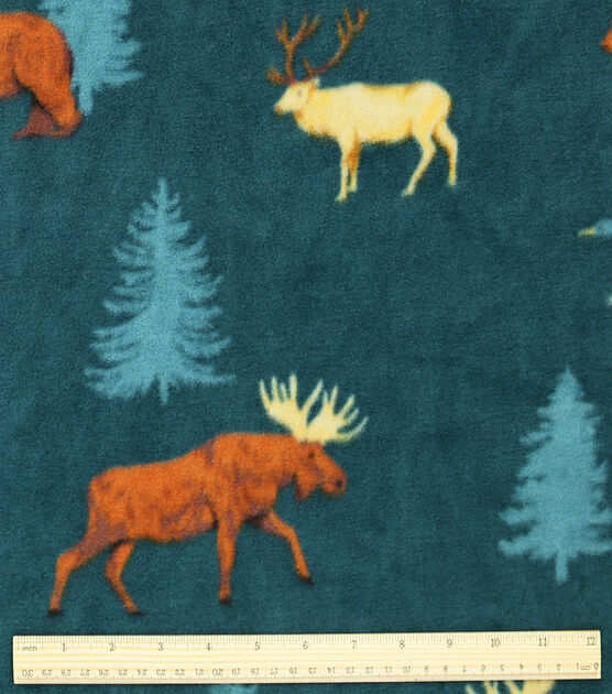 Deer Silhouettes on Blue Anti Pill Fleece Fabric | JOANN