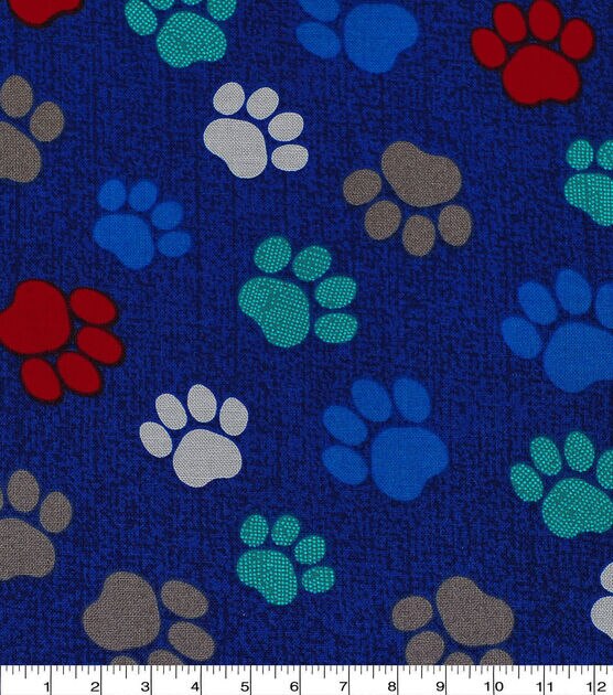 Paw Prints On Navy Novelty Cotton Fabric