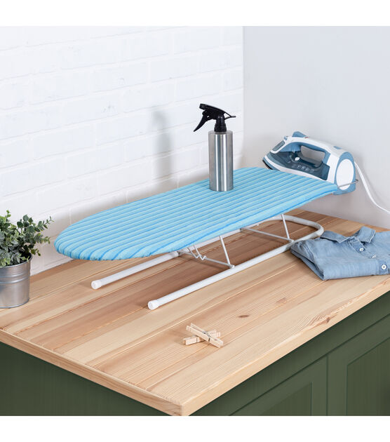 This iron attached to a table doubles up so you'll never have to hide your ironing  board again! - Yanko Design